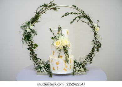 Three Tier Wedding Cake With Gold Leaf And Fresh Flowers