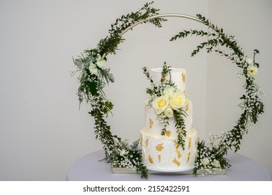 Three Tier Wedding Cake With Gold Leaf And Fresh Flowers