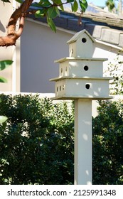 Three Tiered Homemade Birdhouse In The Garden