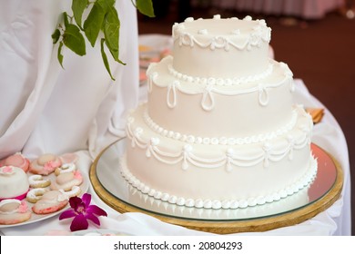 Three Tiered Wedding Cake With White Icing