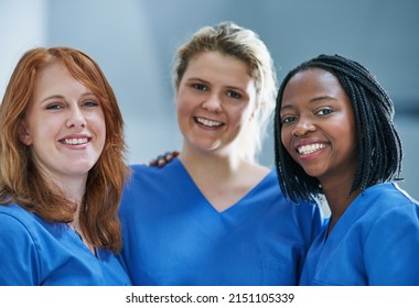 Three Times The Surgical Skill. Portrait Of A Team Of Confident Young Surgeons Working In A Hospital.