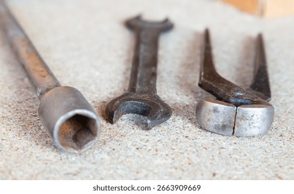 Three tools are shown on a grey surface
