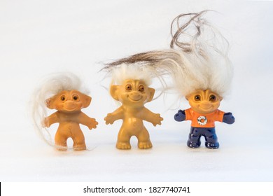 Three toy trolls with white background
