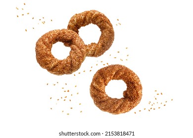 Three traditional turkish simit bagels with sesame flying falling isolated on white background.  - Powered by Shutterstock