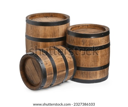 Three traditional wooden barrels on white background