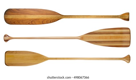 three traditional wooden canoe paddles with different shape of blades isolated on white