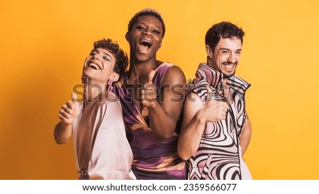 Three trans men gesturing to be fine with the thumb up on yellow