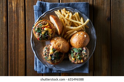 Three Turkey Burger Sliders With Fries Shot From Over Head In Flat Lay Composition