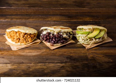 Three Types Of Arepas, Latin American Food On Wood Table