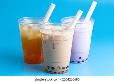 Three Types of Boba Tea on a Blue Background - Shutterstock ID 2204265685