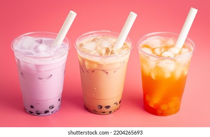 Three Types Of Boba Tea On A Pink Background