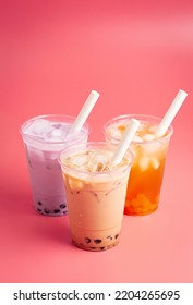 Three Types Of Boba Tea On A Pink Background