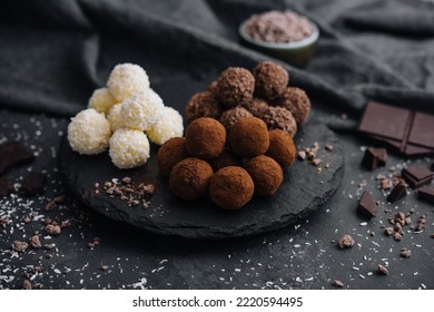 three types of chocolate balls on stone board - Powered by Shutterstock