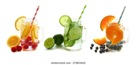 Three Types Of Healthy Detox Water With Fruit In Mason Jars Isolated On A White Background