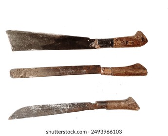 Three types of old rusty machetes isolated on a white background. old antique machete. In Indonesia, this tool is called a "parang" and its function is to split coconuts, split bamboo