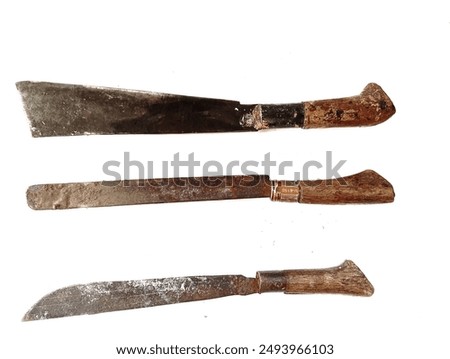 Three types of old rusty machetes isolated on a white background. old antique machete. In Indonesia, this tool is called a "parang" and its function is to split coconuts, split bamboo