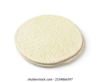 Three uncooked frozen pizza dough bases isolated on white