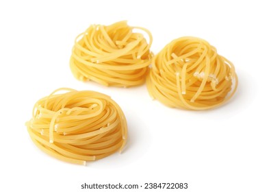 Three uncooked spaghetti pasta nests isolated on white - Powered by Shutterstock