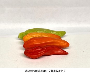 Three units of raw chilli with different colors on the floor, chilli, Horizontal, image