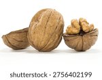 Three walnuts on white background â€” one whole, one open shell, one cracked revealing the kernel inside.