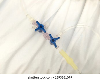 Three Way Stop Cocks (3-way Stopcock) On White Background Is Medical Equipment Attachment Of Extension Lines For Intravenous Therapy System (IV Drip) To Open ,close Lines ,reduce To Lines Down To One