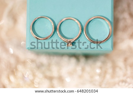 Three wedding rings. Engagement ring, bridal ring and groom ring on the box.