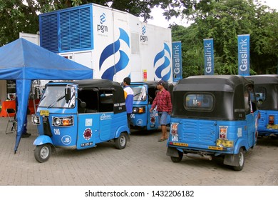 Three Wheel Taxi Or Known As Bajaj CNG At CNG Fuel Station, Monas Square, Jakarta, October 1 2014.