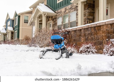 Three Wheel Toy Bicycle For Kids On The Yard Of Apartment On A Snowy Winter Day