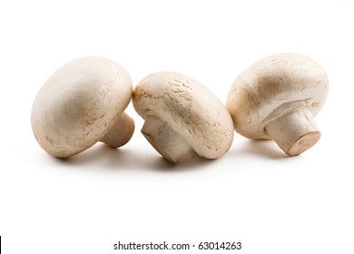 Three White Button Mushroom Isolated On White Background.