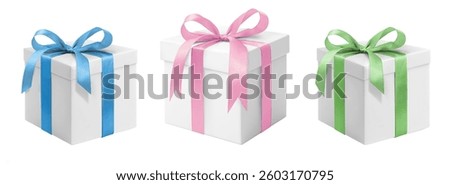 Three white gift boxes in vibrant blue, soft pink, and fresh green with elegant ribbons on a white background