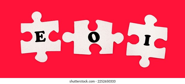 Three white jigsaw puzzles with the text EOI Expression of Interest on a bright red background. - Shutterstock ID 2252650333