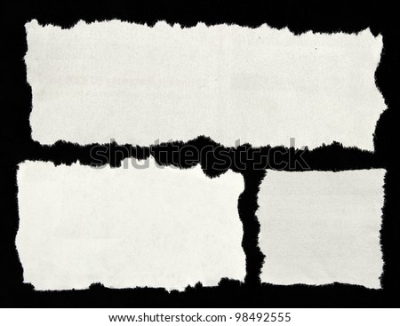 Three white newspaper clippings on black background. Copy space for advertising