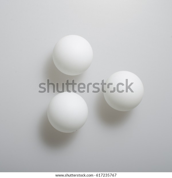 Three White Ping Pong Balls Lie Stock Photo Edit Now 617235767