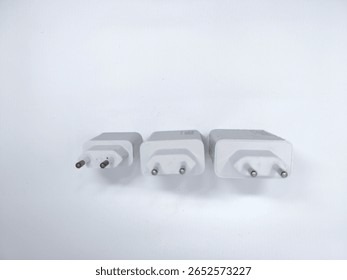 Three white power adapters with different wattage ratings (120W, 90W, and blank) arranged on white background. Ideal for electronics or charging accessories themes.
