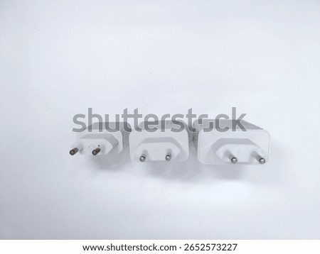 Three white power adapters with different wattage ratings (120W, 90W, and blank) arranged on white background. Ideal for electronics or charging accessories themes.
