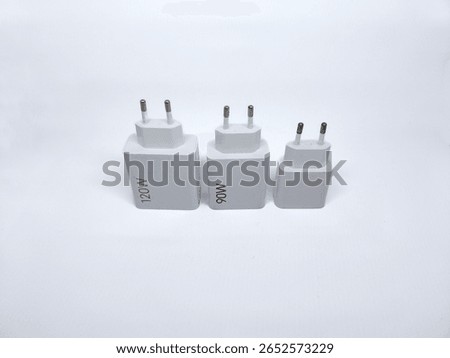 Three white power adapters with different wattage ratings (120W, 90W, and blank) arranged on white background. Ideal for electronics or charging accessories themes.
