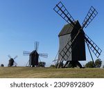 Three windmills with blue sky