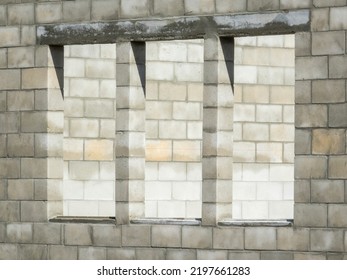 Three Window Openings In Exterior Wall Of Concrete Shell Of Single-family House Under Construction On A Sunny Morning In Southwest Florida