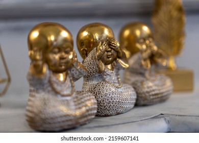 Three Wise little Buddha figurine in a row, Hear no evil, See no evil, Speak no evil, Bronze little statue home decoration concept - Powered by Shutterstock