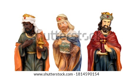 The three wise men. Ceramic figures isolated on white background 