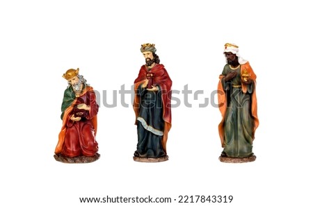 The three wise men. Ceramic figures isolated on white background 
