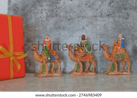 Three Wise Men gift box on grey background