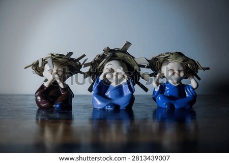Three Wise Monk Figurines .