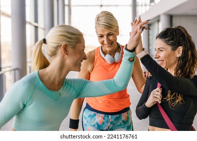 Three woman are happy after a successful training - Powered by Shutterstock