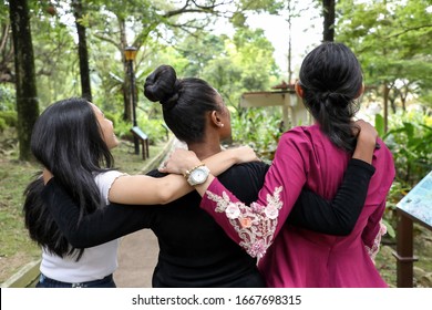 Three Woman Malay Chinese Indian Asian Outdoor Green Park Walk Talk Mingle Happy Joy From Behind Look Up