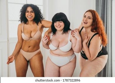 Three women posing for body positive studio portraits. Celebrating and having fun. Concept about lifestyle and body positivity
