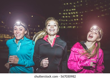 Three Women Running In The Night In The City Center