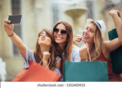 Three Women Shopping Together And Make Selfie Photo