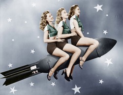 Three Women Sitting On A Rocket