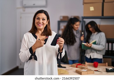 Three Women Working At Small Business Ecommerce Smiling Happy Pointing With Hand And Finger 